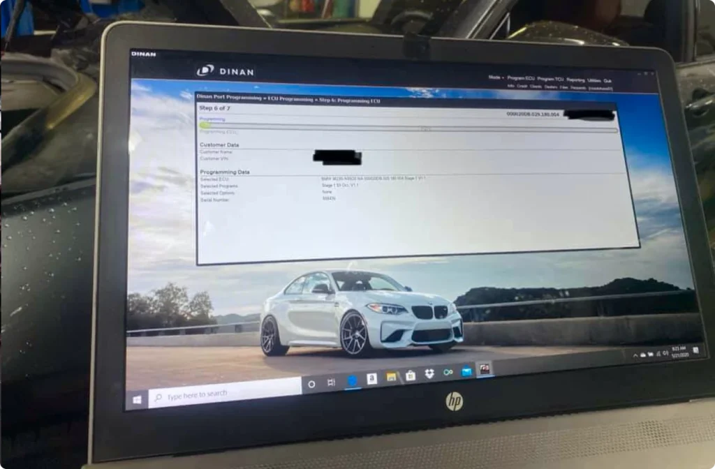 performance upgrade, auto repair in Centerville, OH at C's Autohaus. Laptop displaying car diagnostics and upgrade window.