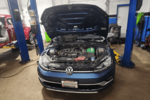 Auto repair in Centerville, OH at C's Autohaus. Image of a Volkswagen vehicle in the repair shop with the hood open during inspection and service, highlighting professional diagnostics, maintenance, and repair solutions designed to keep European vehicles performing safely, efficiently, and reliably.